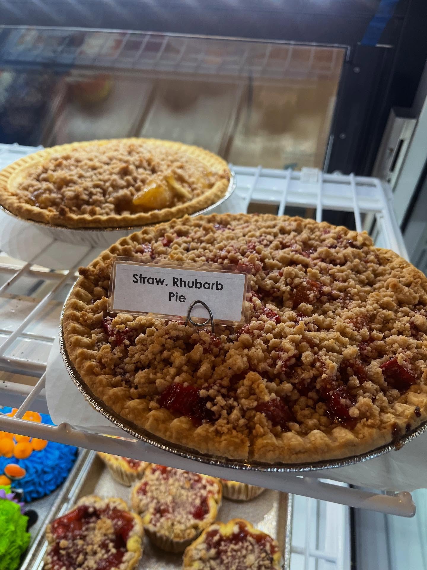 Lattice-top fruit pies fresh from the oven in the bakery display case